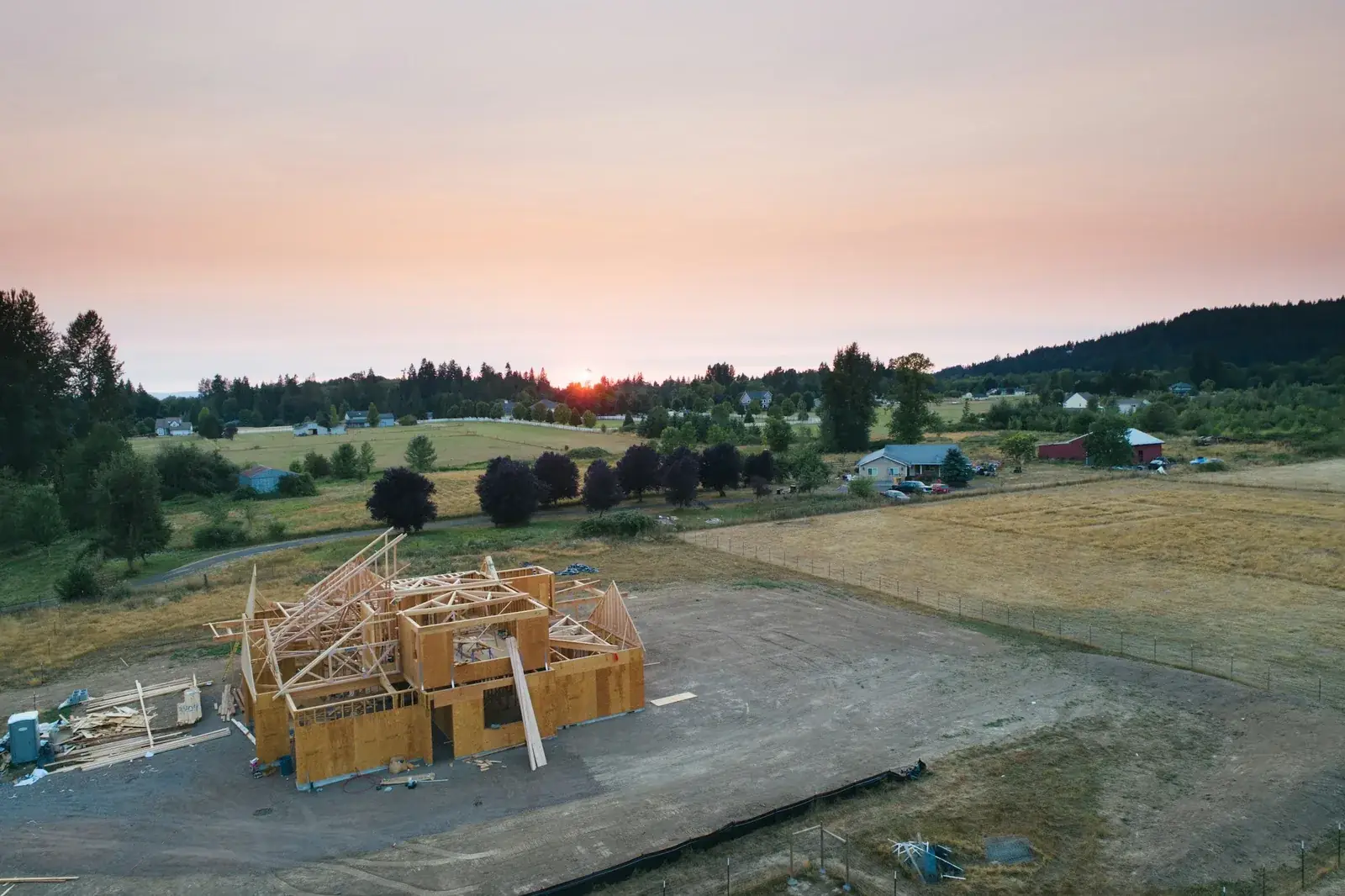 Construction site with steel framing against the sky