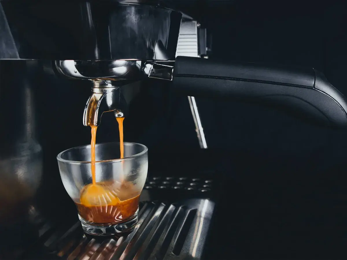 Espresso extracting from a portafilter
