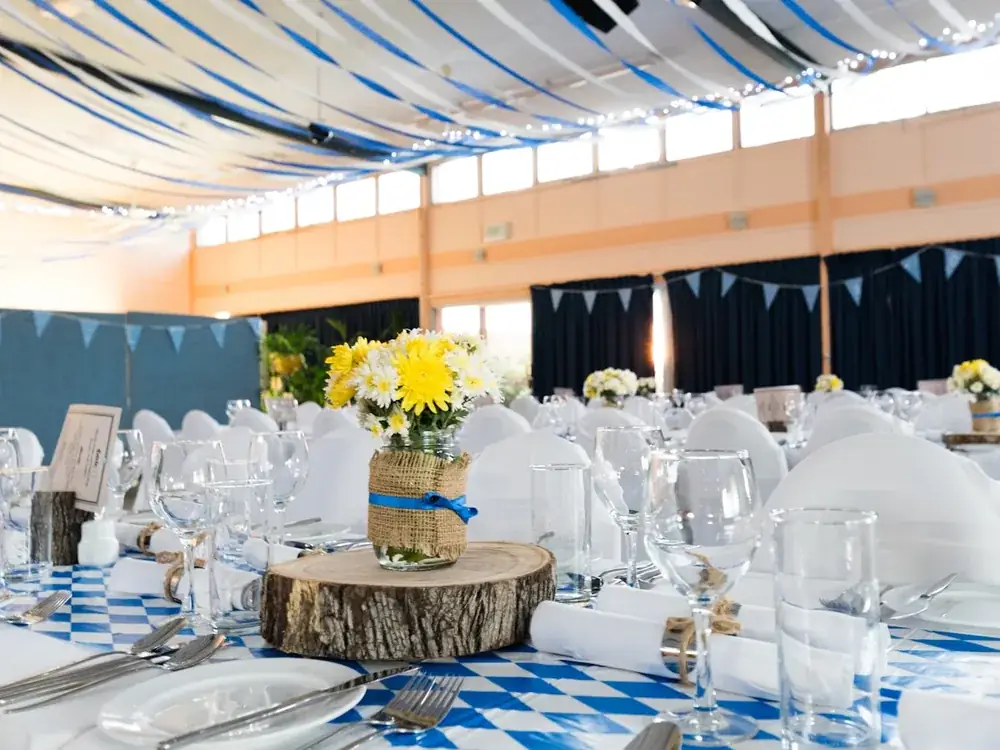 A reception hall strung with warm lights